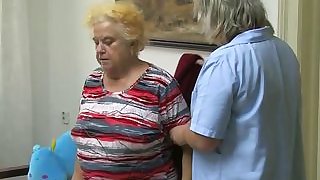 Mature woman using dildo on chubby granny